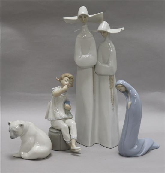 A tall Lladro group of two nuns, glazed in white and three other Lladro figures, tallest 33.5cm (4)